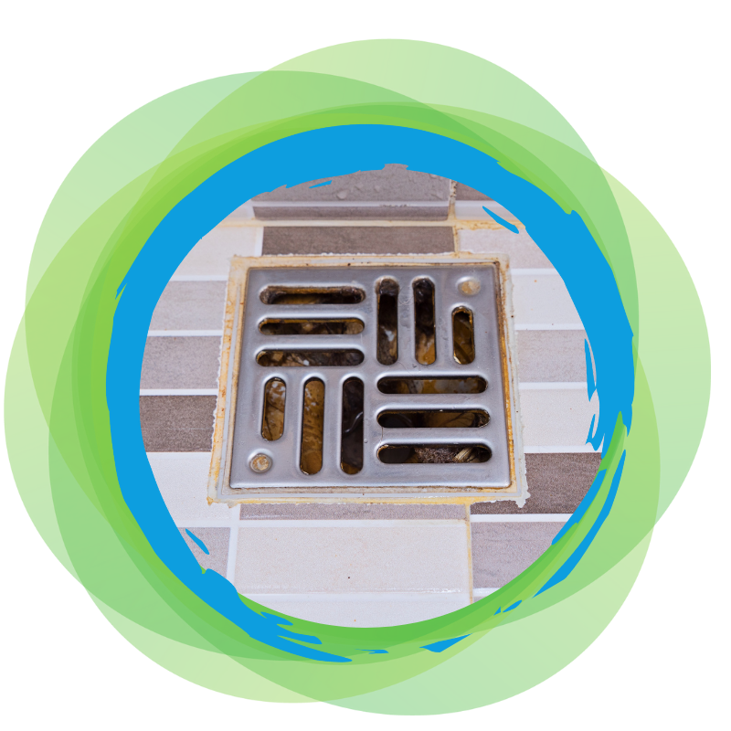 Bathroom blocked drain with clogged debris under a metal grate on tiled flooring, causing slow water drainage and potential overflow.