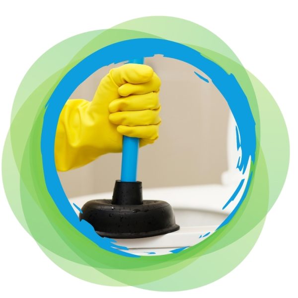 Hand in yellow gloves using a plunger to fix a toilet blocked drain in a bathroom.