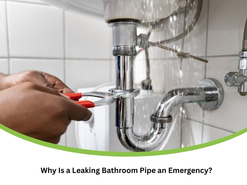 Close-up of hands tightening a leaking bathroom pipe with pliers as water escapes under sink